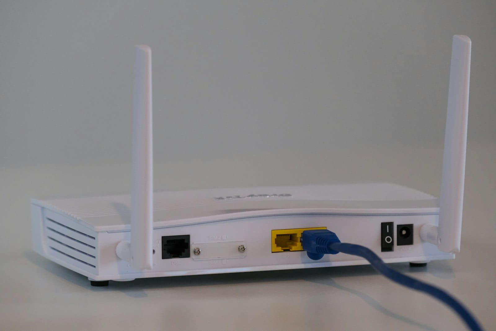 Home router with an Ethernet cable plugged in